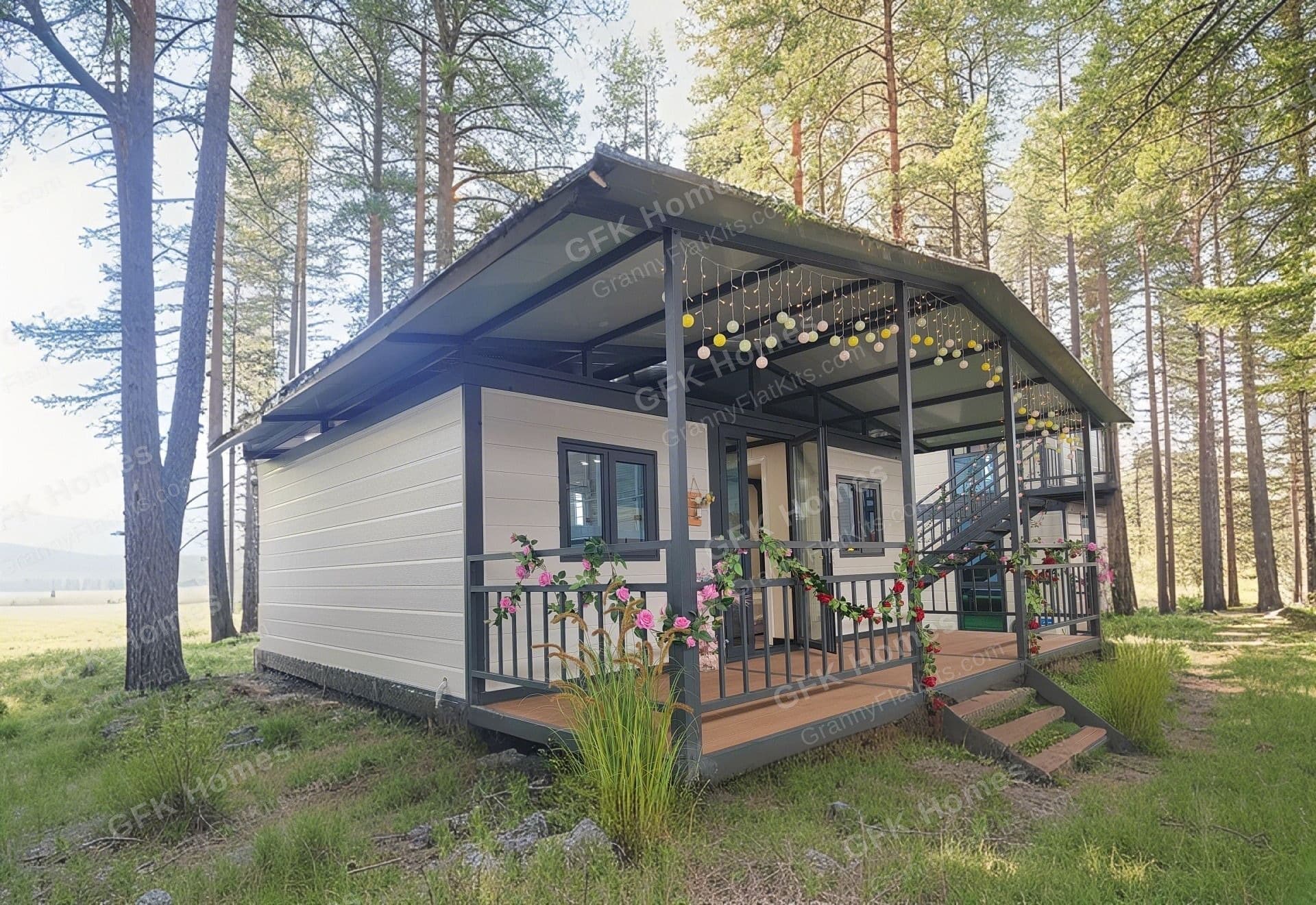 Two-storey modular granny flat kit deployed in a forest clearing with pine trees