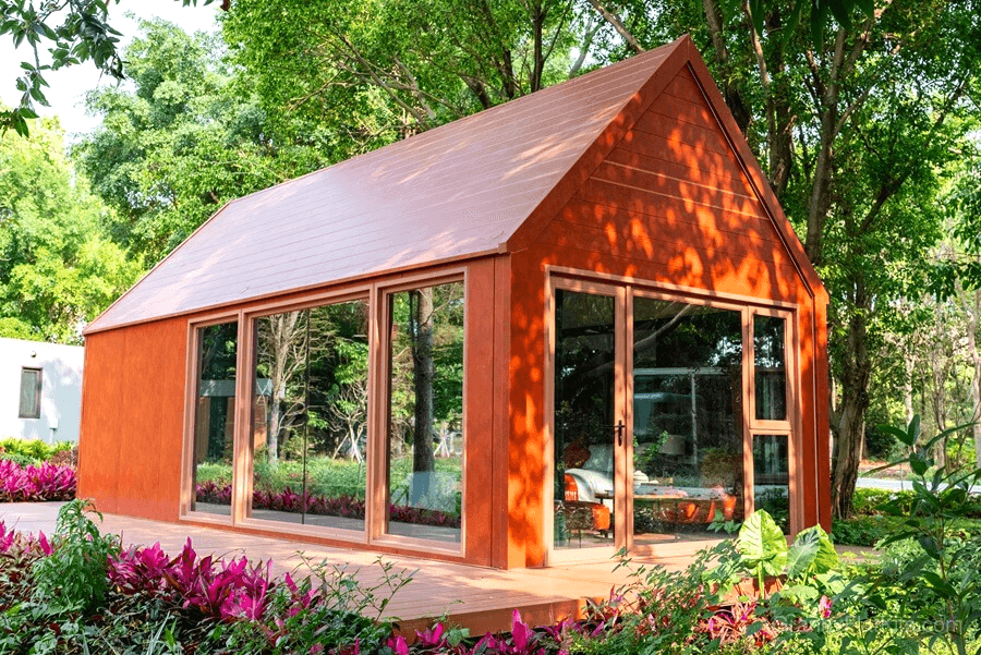 Modern granny flat exterior view showing dramatic high-ceiling loft design