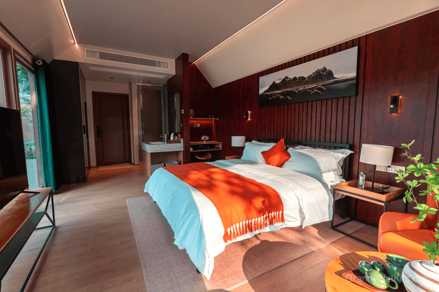 Loft granny flat bedroom with floor-to-ceiling windows and loft atmosphere