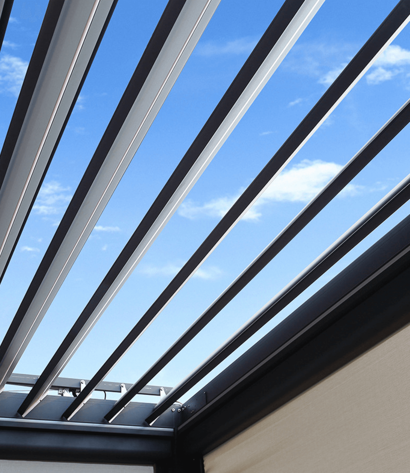 Motorized louver blade engineering close-up showing 1.4mm thick aluminum blades against blue sky
