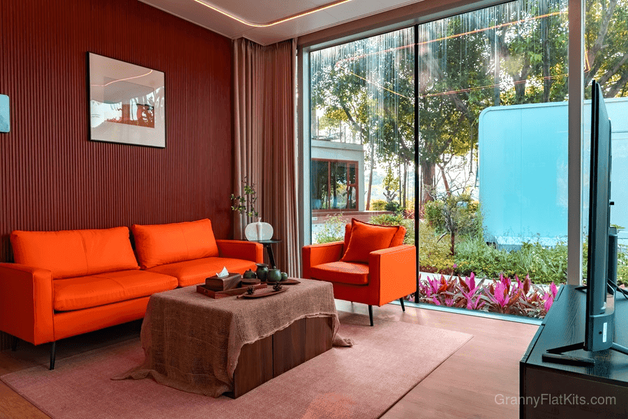 Modular home side exterior view with reflective glass panels