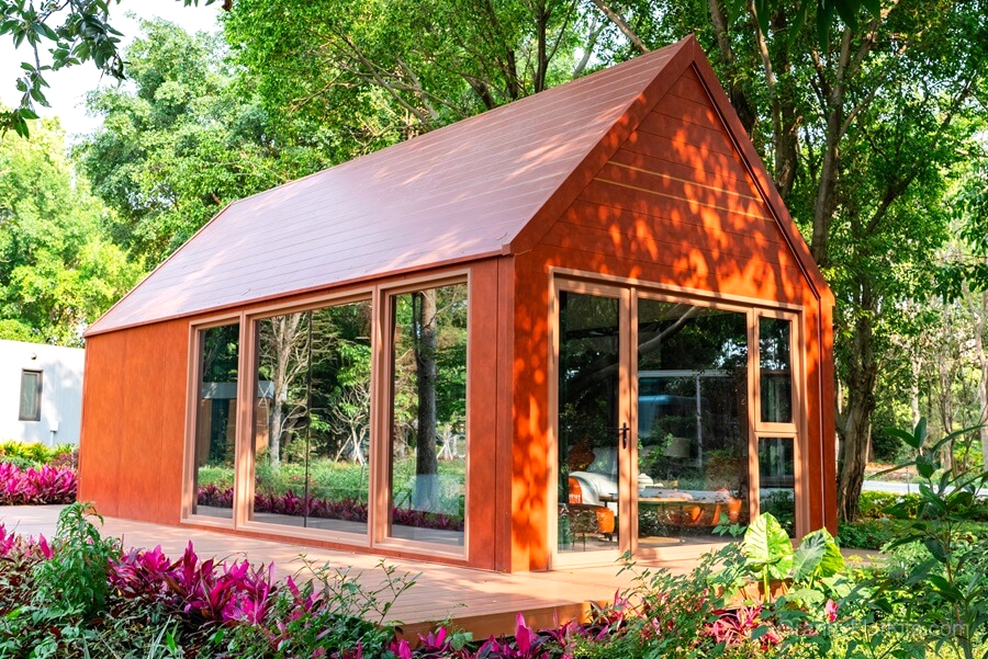 Modern granny flat exterior view showing dramatic high-ceiling loft design